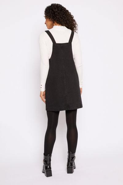 denim pinafore dress with tights